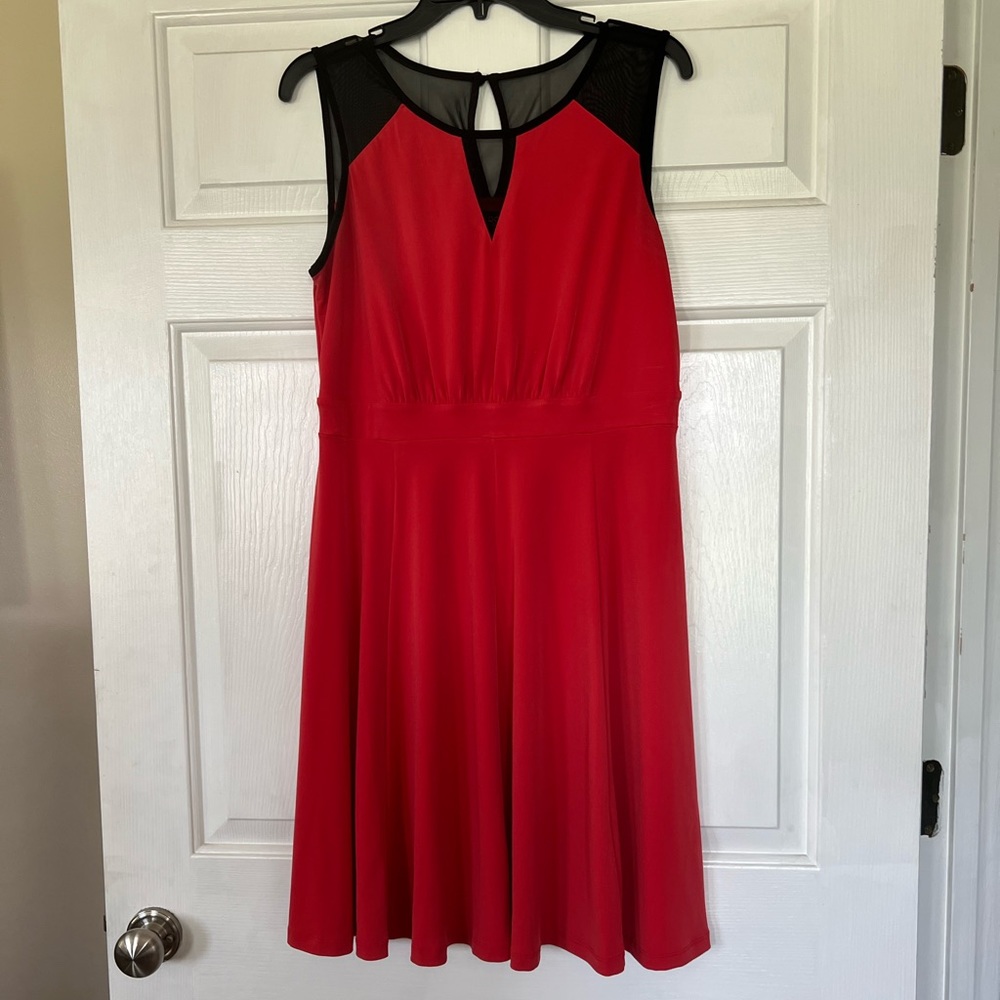 Red dress with black mesh details.